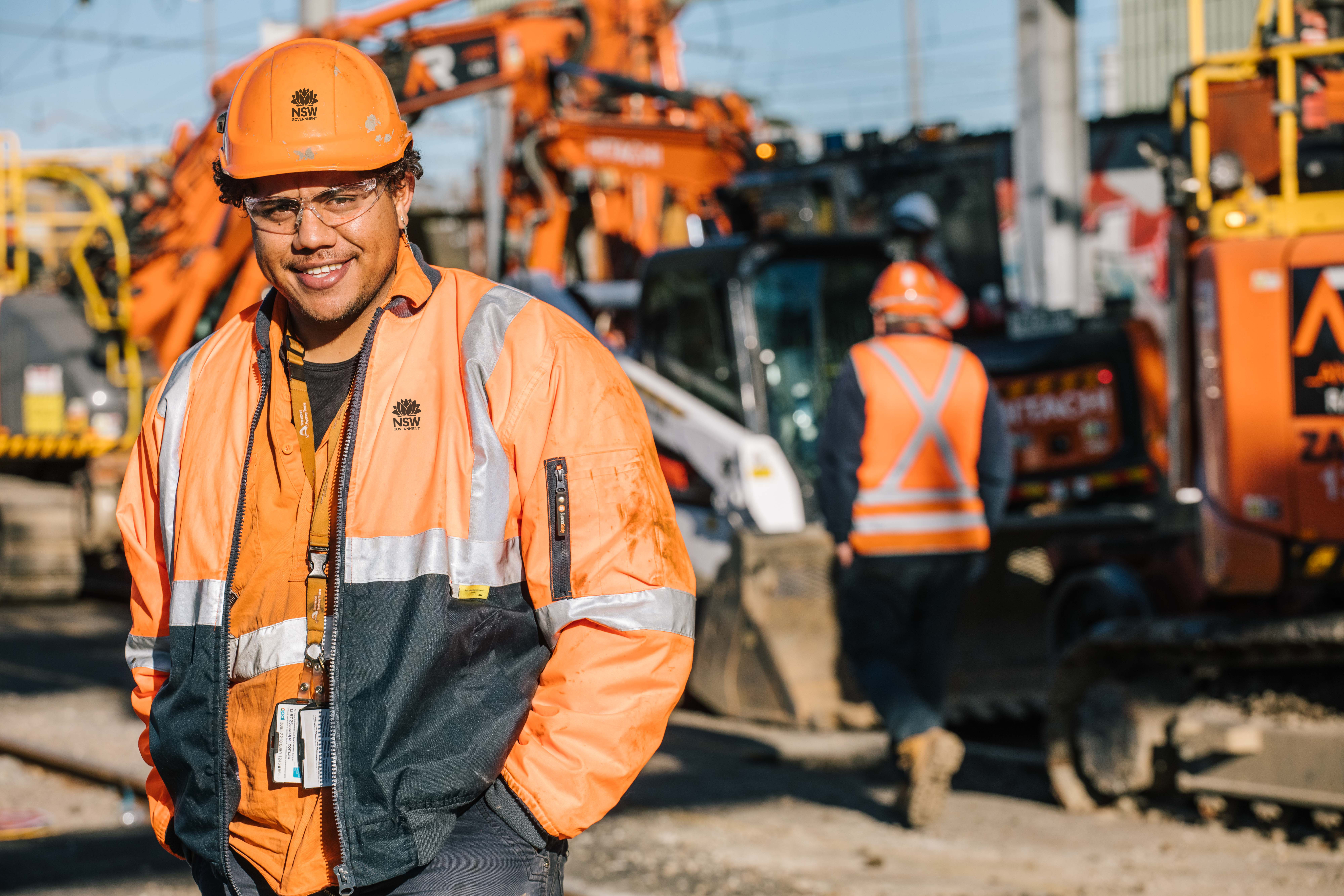 Rail workers on machinery