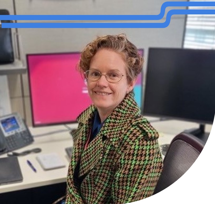 Woman working in front of computers
