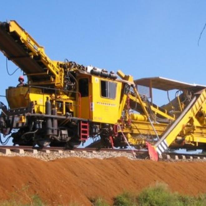 Track bound rail machinery laying track.